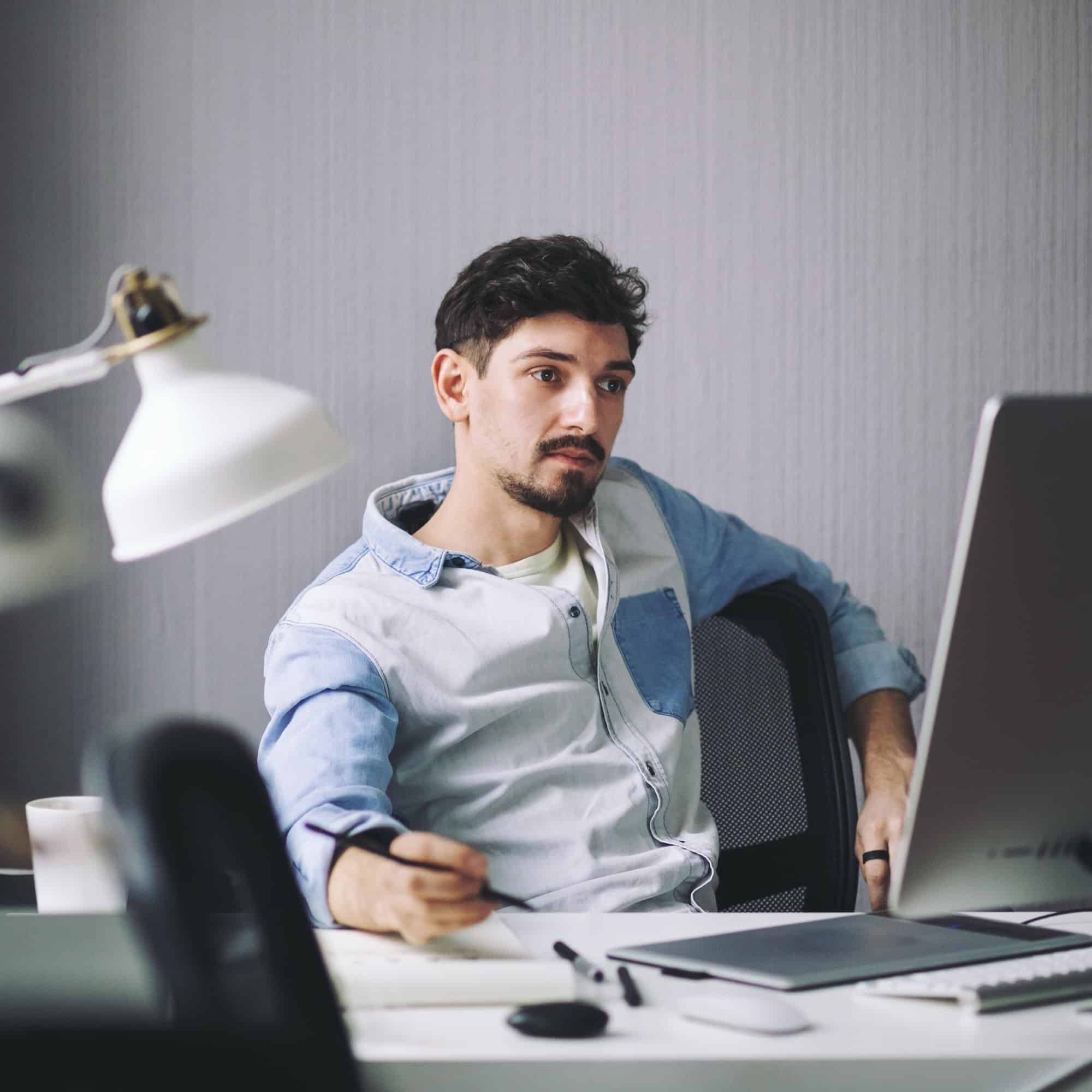 handsome-businessman-working-in-office.jpg handsome-businessman-working-in-office.jpg